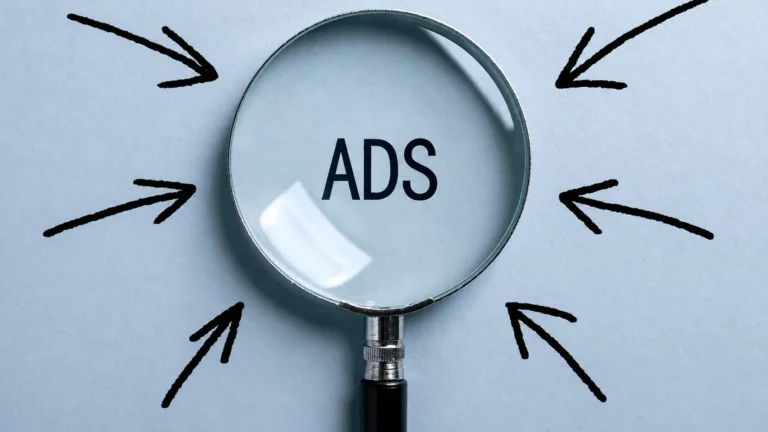 Social media ads concept with magnifying glass highlighting online advertising strategy